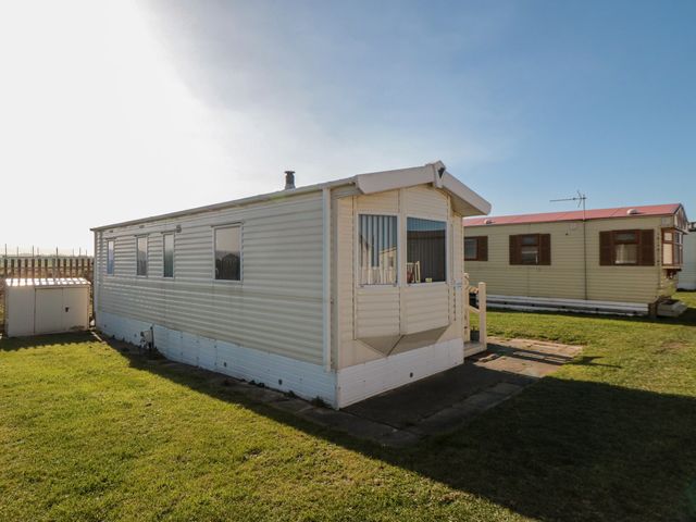 A caravan in an outdoor setting at Caravan 132 Redcar