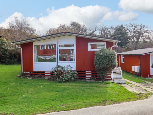 A house with a green garden at Chalet 23 Erw Porthor Tywyn