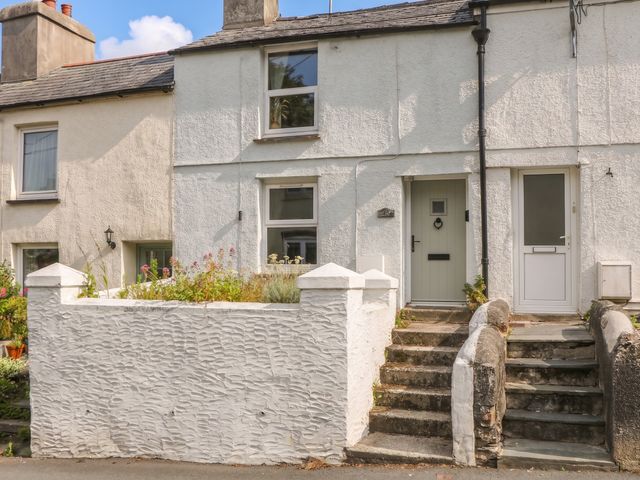 A house exterior with front door and steps at Bedford Cottage in Yelverton