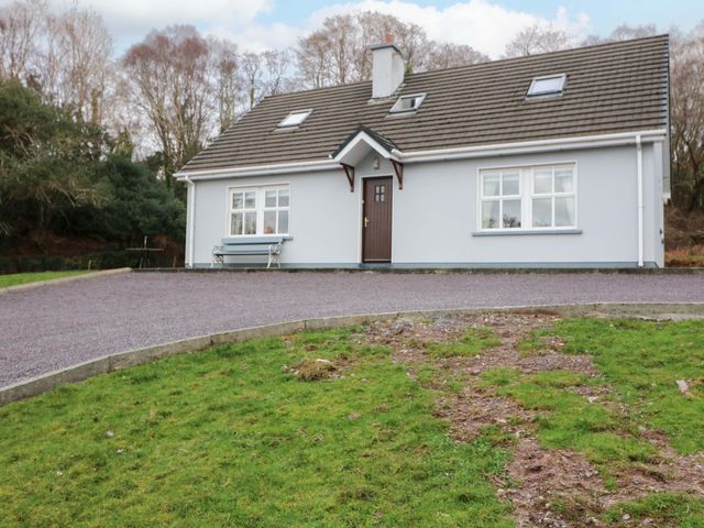 A house with front door and windows at Lugdine Lodge in Glengarriff