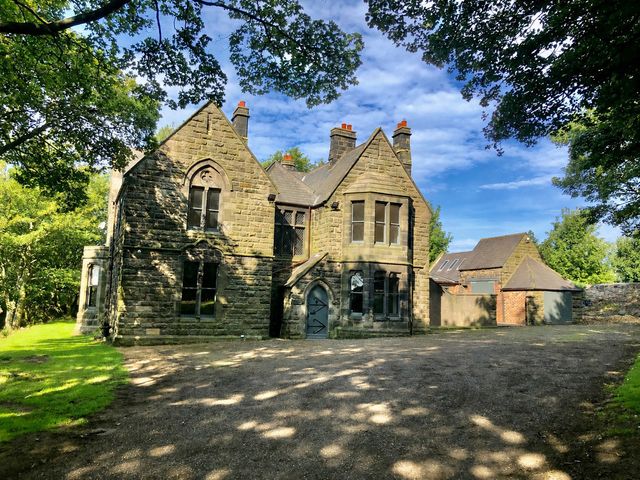 A stone building with windows and a garden at Flaxstead Grange in Newbottle
