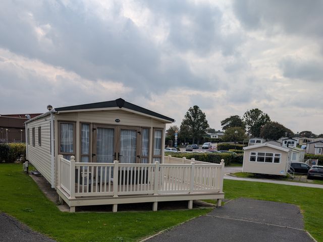 A static caravan with a deck at 42 Laurel Rise in Primrose Valley