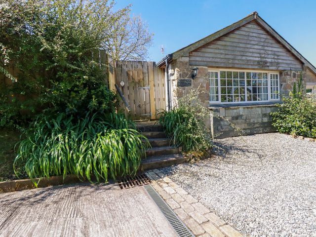 A entrance with steps and gravel at Millies Place St Austell