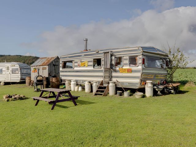 An outdoor area with a caravan and wooden shed at 2 x Double Bed Glamping Wagon at Dalby Forest Scarborough