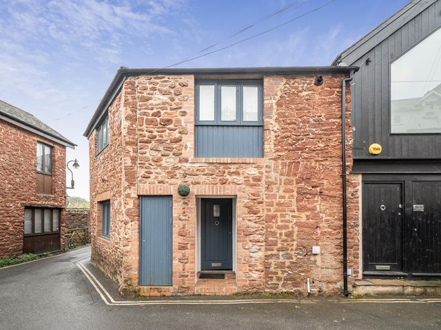 An exterior view of a brick building in a street at Seaside Cottage Escape in Paignton
