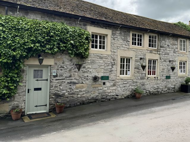 A stone building with a door and windows at Stunning cottage - 3 Bedrooms & 3 Bathrooms