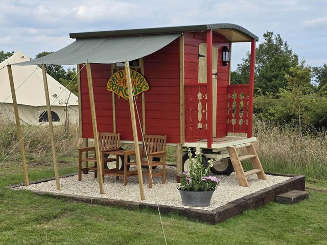 A circus wagon with outdoor seating at Restored circus wagon in Saltburn-By-The-Sea