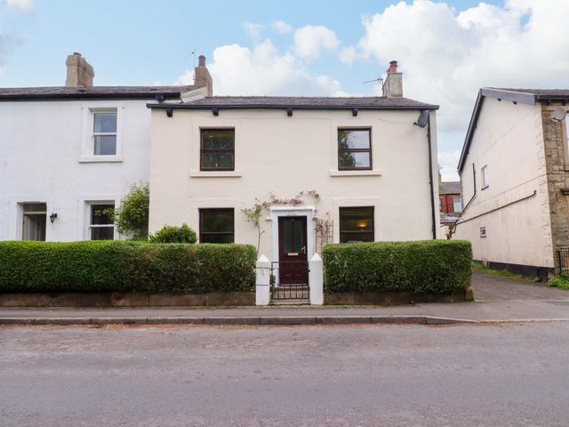 A house with a front door and windows at 6 Hazel Moor in Blackburn