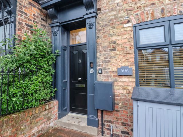 An entrance with a black door and a mailbox at Blacksmiths Retreat in York