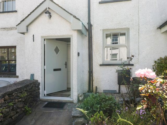 An entrance with a front door and flowers at Bobbin Nook