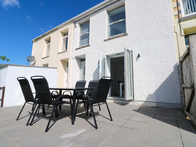 An outdoor patio with furniture at Mountain View Cottage in Ystradgynlais