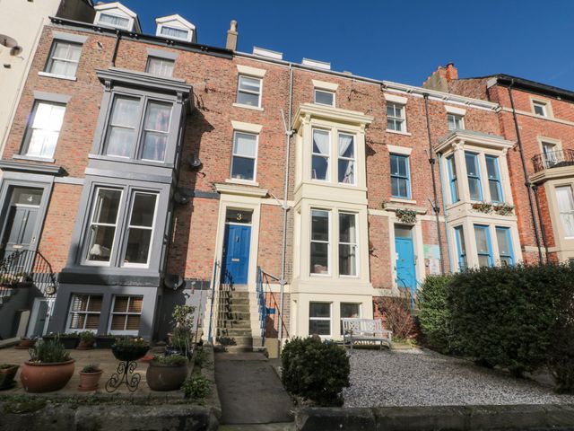 A building exterior with stairs and windows at Cuckoo's Nest in Whitby