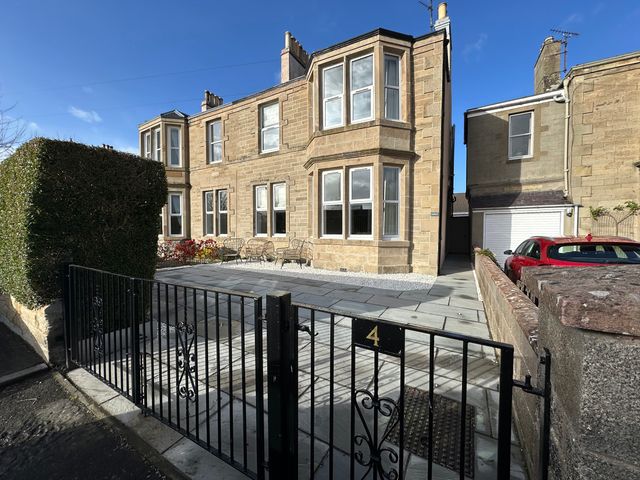 A house with windows and a gate at Abbotsford in Kelso