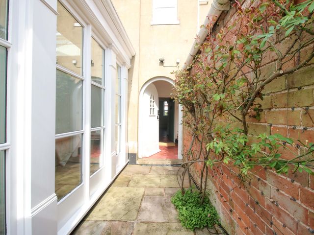 An outdoor area with a pathway and plants at The Apartment at the Grey House in Albrighton
