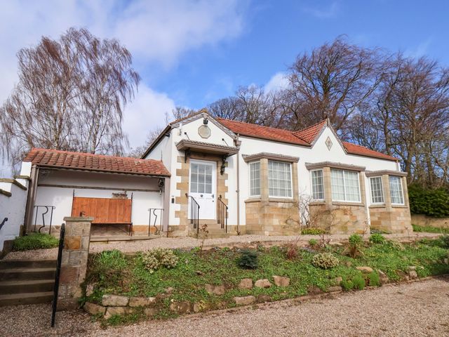 A house with a pathway and garden at Hawthorn Lodge in Whitby