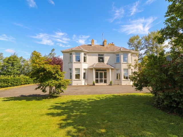 A house with lawn and trees at Riverdene in Mountjoy