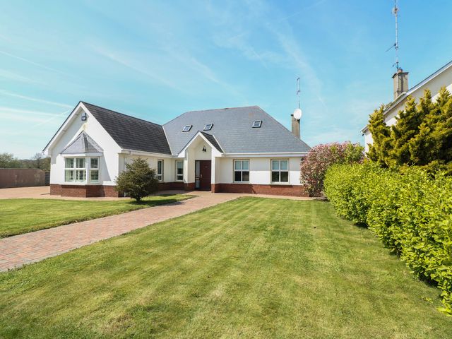 A house with a garden and pathway at Sunnyside River Chapel near Courtown, County Wexford