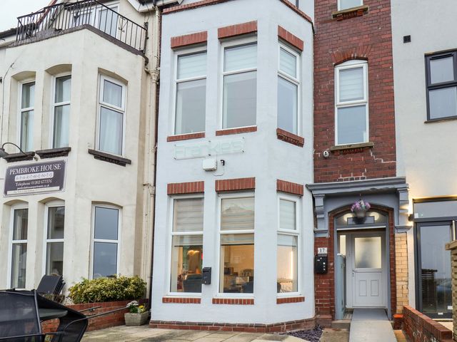 An entrance facade of a building with a sign at Frankie’s Seaview 1 Bridlington