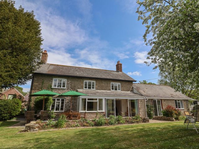 A house with garden and seating area at Harbins Farm in Glanvilles Wootton Nr. Sherborne