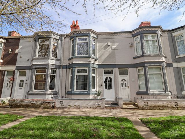 A house with multiple windows and doors at Ince Lodge Liverpool
