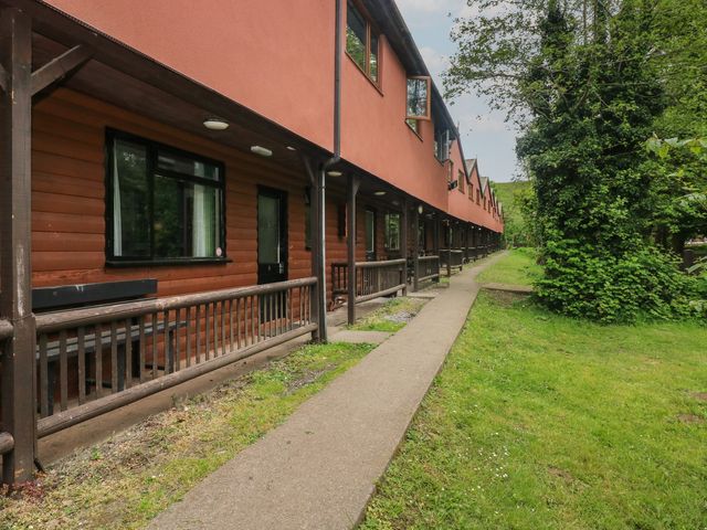 An outdoor pathway beside a building at Cabin No. 8 - Salt and Fern Cabins Goytre near Port Talbot