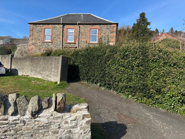 A house with hedges and a pathway at Broombank in Melrose