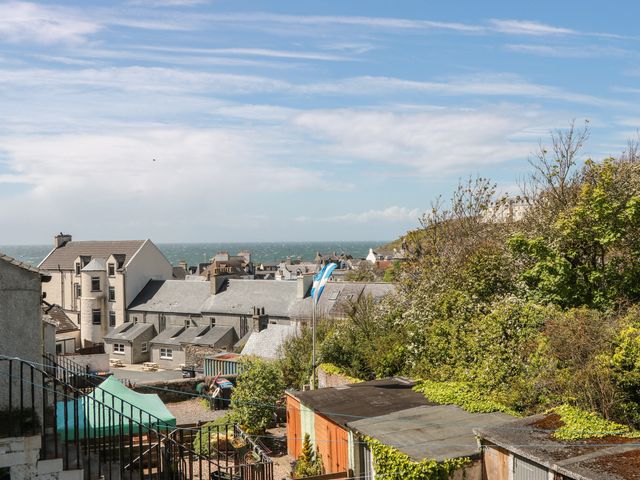 A view of rooftops and the sea at Olea Portpatrick