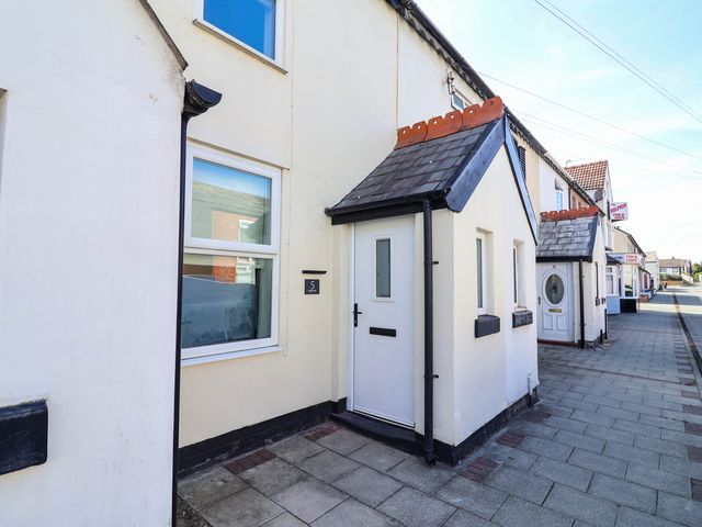 A house exterior with a door and windows at Brightside in Hoylake