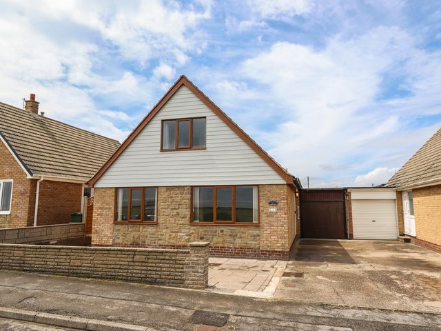 A house with stone facade and garage at Sandringham in Withernsea