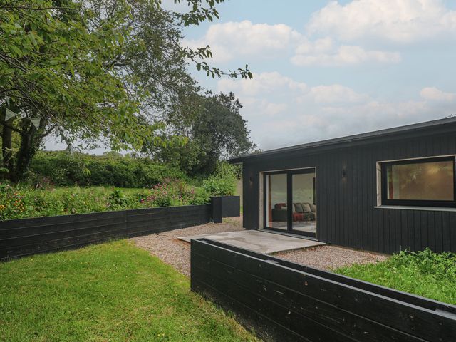 A house with a garden and patio at Birdsong in Gulval
