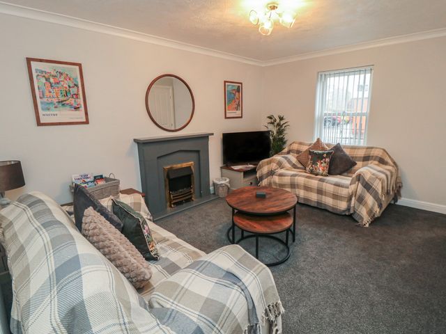 A living room with sofas and a coffee table at 3 Railway Terrace in Bridlington