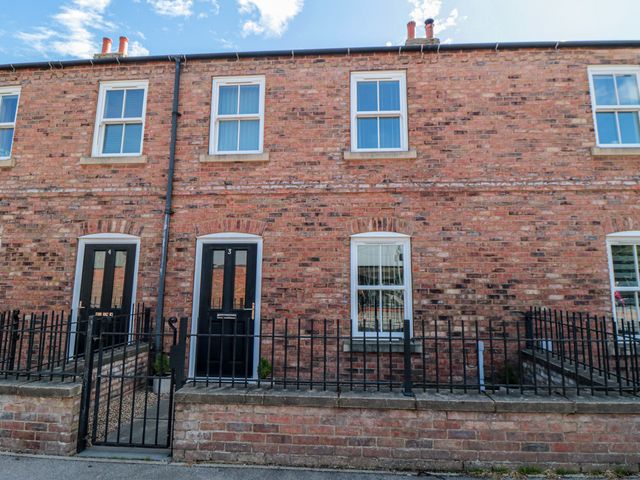 A brick facade with windows and doors at 3 Railway Terrace in Bridlington