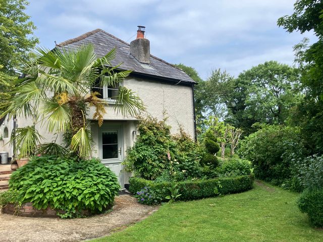 A house with garden landscaping at The Bothy at Lewis Cottage Spreyton