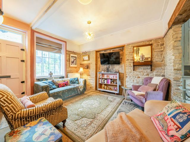 A living room with a sofa and armchair at Hebden Bridge - House - Sleeps 8 - Pet Friendly, Hebden Bridge