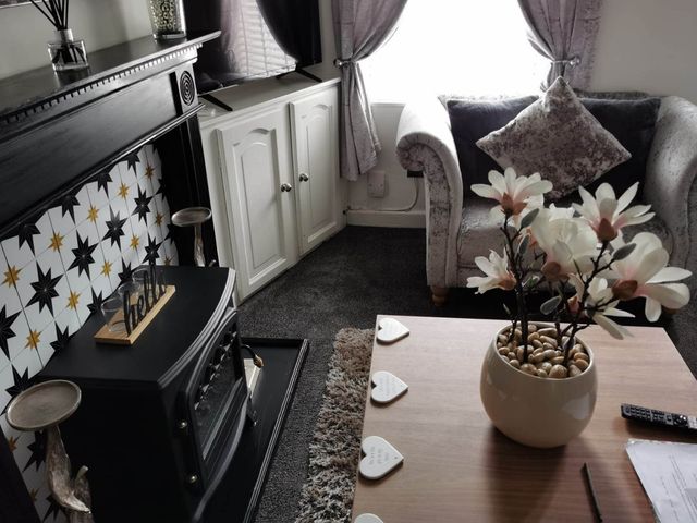 A living room with a sofa and coffee table at Stunning 2-Bed House in Macclesfield Cheshire