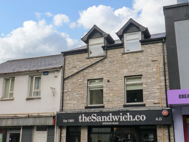 A building with a restaurant sign at theSandwich.co on Spencer Road Londonderry