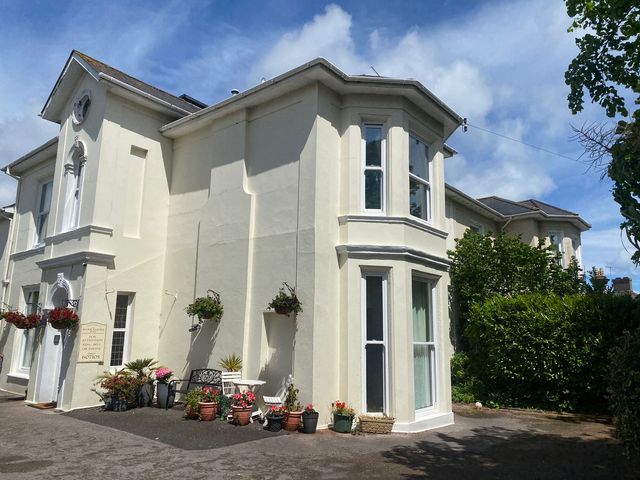 A building with planters and flowers at Apartment 4 in Torquay