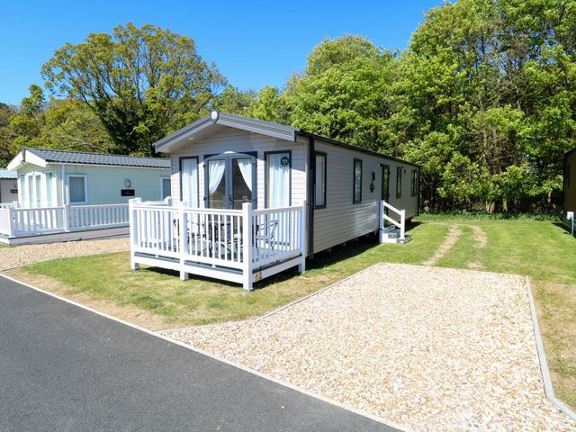 A caravan with decking and steps at The Honey Pot Retreat in Fritton near Belton, Norfolk