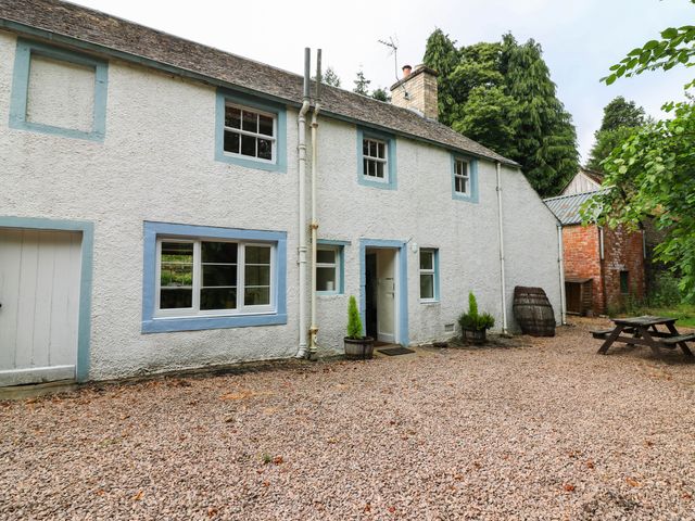 A house with windows and a door in Gardener’s cottage Stanley