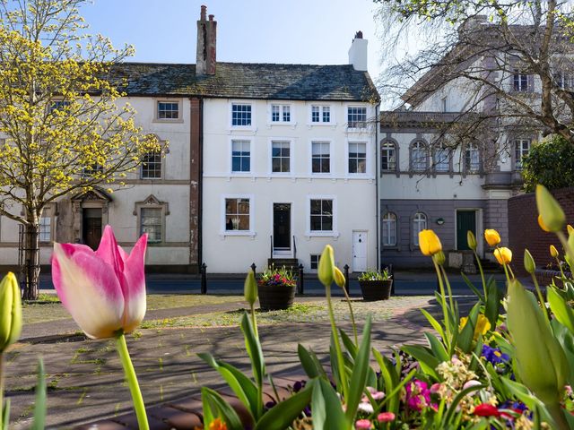 A street view with flowers and buildings at Admirals home