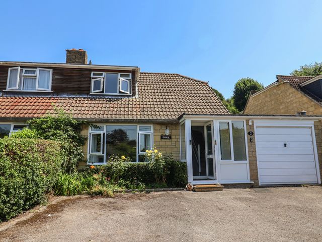 A house with a garage and garden at Tane in Winterborne Stickland