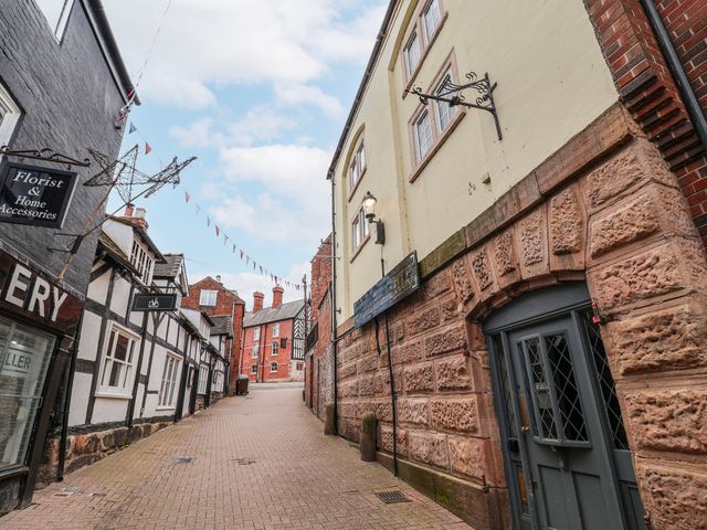 A street with buildings and shops at Top floor apartment