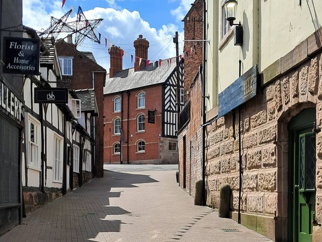 A street with shops and decorations at The Georgian Apartment in Congleton