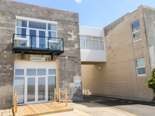A building exterior with balcony and entrance at Portland View in Portland Bill