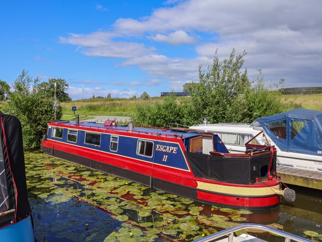 A boat named Escape II on the water at Oakwood Marina