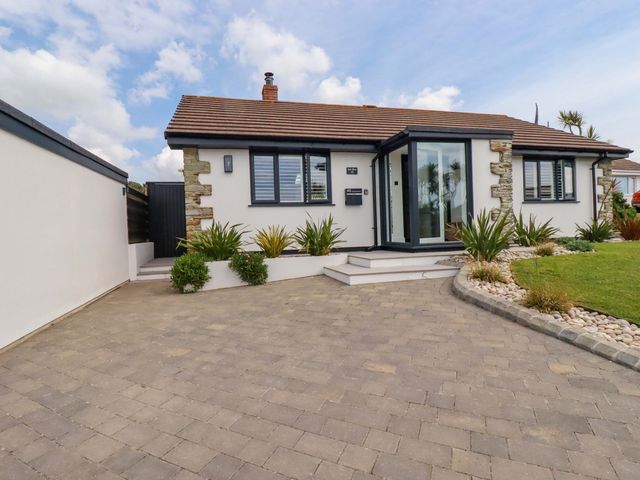 A house with a front door and garden at No.45 Whealgolden Drive Newquay