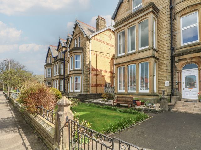 A building with windows and a garden at Apartment 4 in Lytham St. Annes
