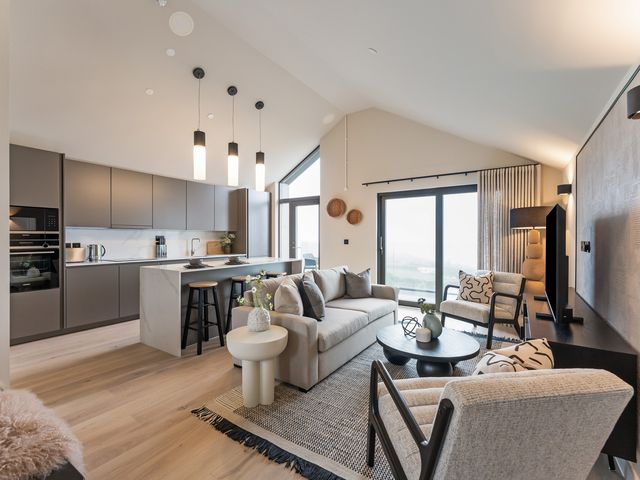 A living room with a sofa and coffee table at tbc in St. Ives