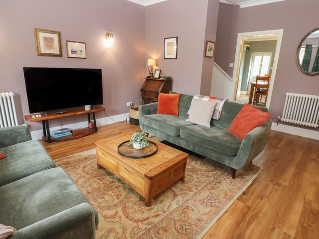 A living room with a coffee table and sofa at 2 West View Richmond