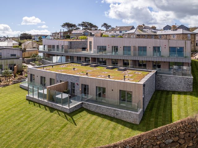A modern building with grass terrace at tbc in St. Ives